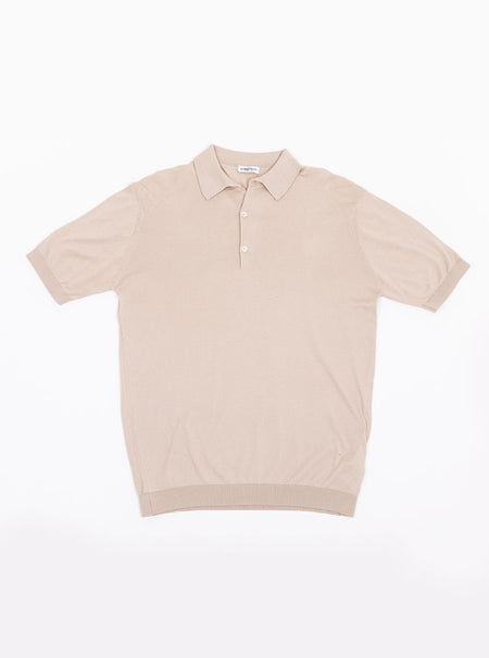 Flat lay of men's almond beige short sleeve polo knit in a luxury and premium 100% merino wool.